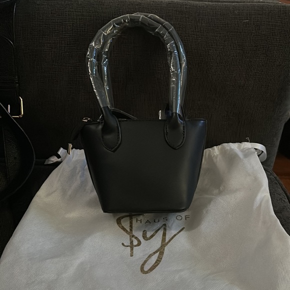 Mini Haus of Sy tote it’s really small comes with a strap also - Picture 2 of 3